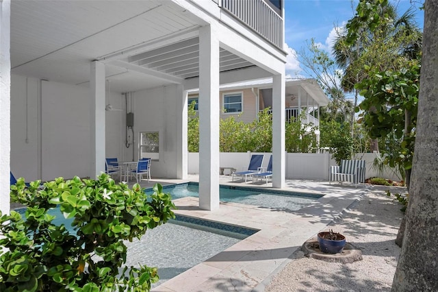 view of patio / terrace featuring fence