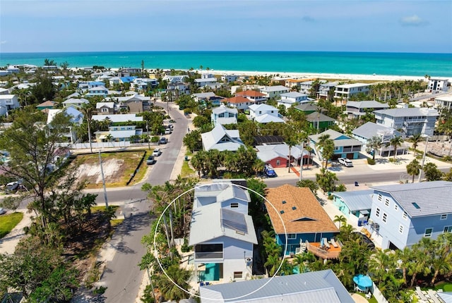 aerial view of residential area with a nearby body of water