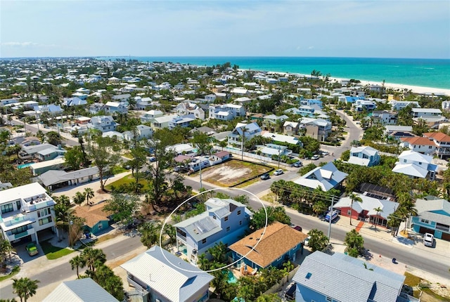 aerial view of residential area featuring a nearby body of water