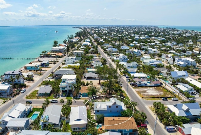 aerial view of residential area with a large body of water