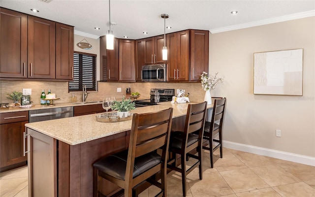 kitchen featuring a sink, ornamental molding, backsplash, and appliances with stainless steel finishes