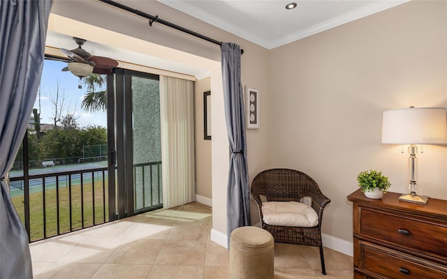 living area featuring crown molding, light tile patterned floors, baseboards, and a ceiling fan