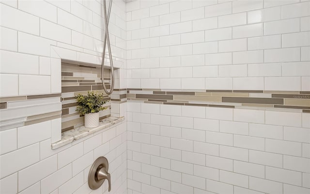 full bathroom with a tile shower