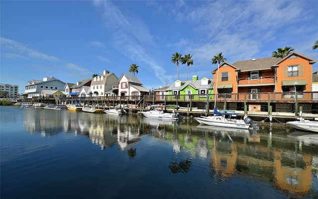 dock area featuring a water view and a residential view