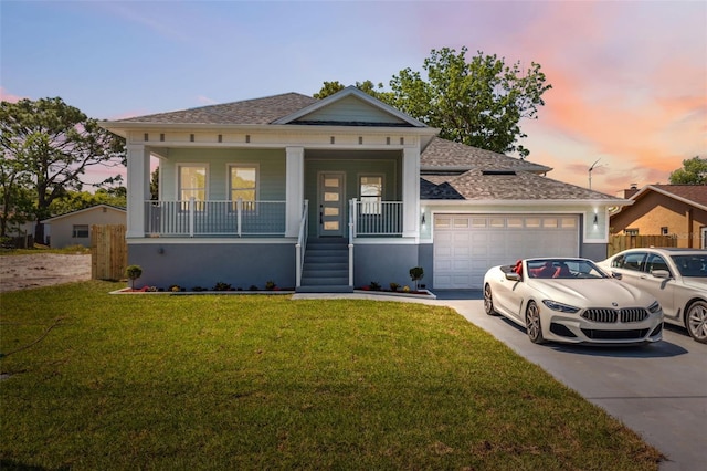 8622 Inwood Dr, Hudson, FL 34667 - view of front of house with covered porch, roof with shingles, an attached garage, driveway, and a yard