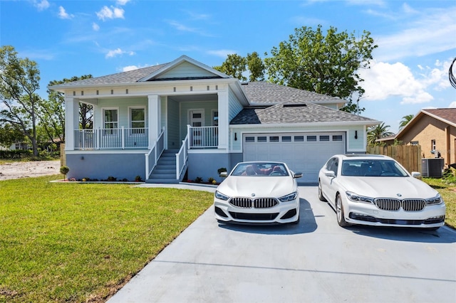 8622 Inwood Dr, Hudson, FL 34667 - single story home with roof with shingles, a front yard, a garage, and driveway