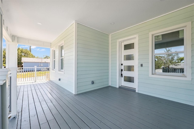 8622 Inwood Dr, Hudson, FL 34667 - wooden terrace featuring covered porch