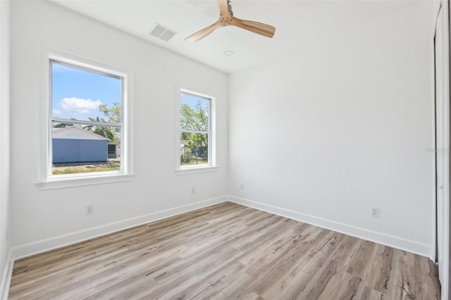 8622 Inwood Dr, Hudson, FL 34667 - empty room with baseboards, light wood-style flooring, visible vents, and a ceiling fan