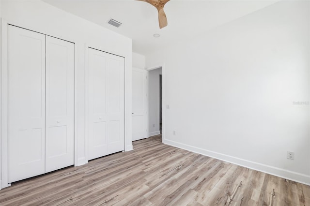 8622 Inwood Dr, Hudson, FL 34667 - unfurnished bedroom featuring baseboards, light wood-style flooring, and visible vents