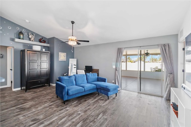 living area featuring ceiling fan, wood finished floors, an office area, baseboards, and lofted ceiling