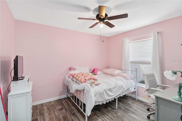 bedroom with wood finished floors, baseboards, and ceiling fan
