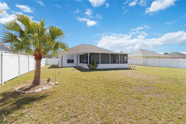 back of property with a sunroom