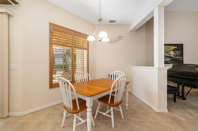 dining space featuring light tile patterned flooring and baseboards