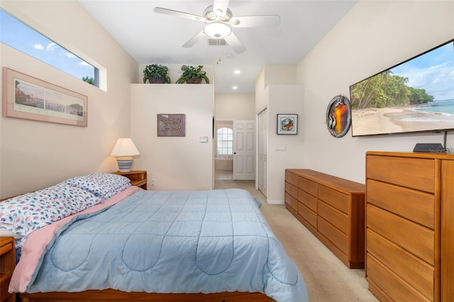 bedroom with multiple windows, light carpet, a ceiling fan, and baseboards