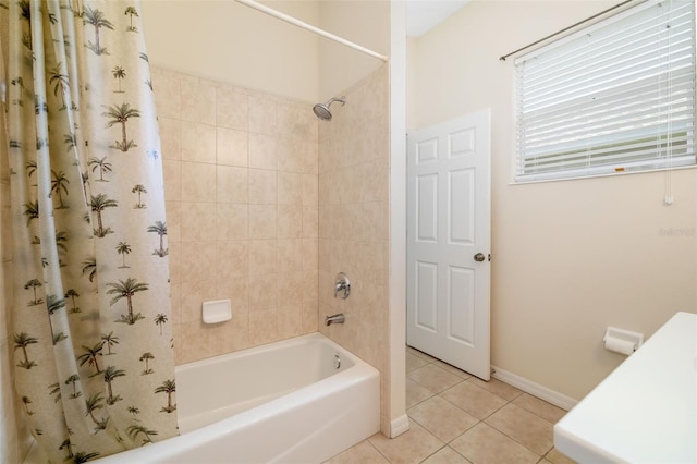 bathroom featuring tile patterned flooring, shower / bath combo with shower curtain, and baseboards
