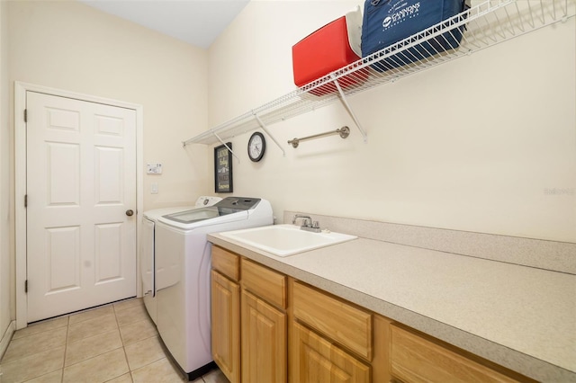 washroom featuring separate washer and dryer and light tile patterned floors