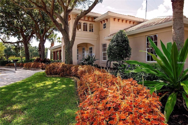 view of side of home featuring stucco siding