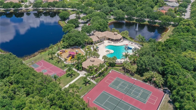 bird's eye view of a nearby body of water and a pool