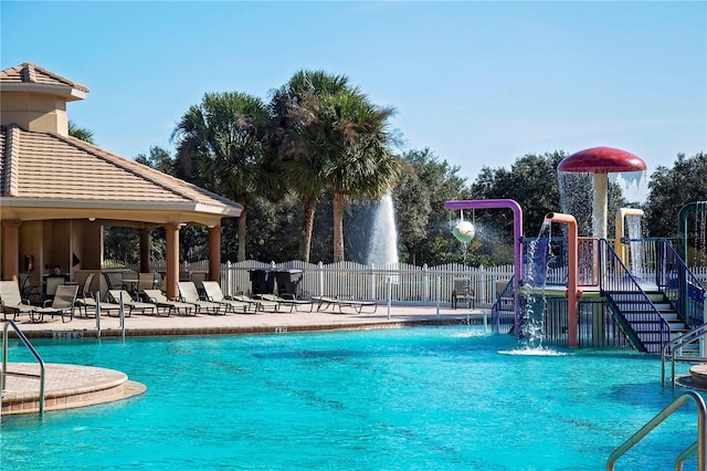 community pool featuring fence, a patio area, and a gazebo