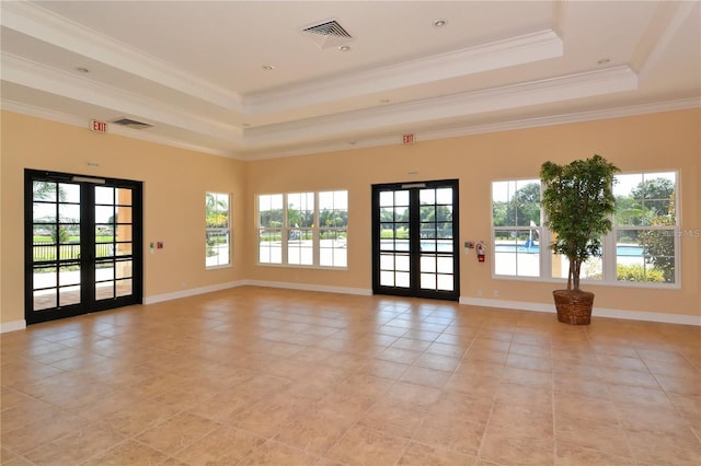 unfurnished room with french doors, a tray ceiling, light tile patterned floors, ornamental molding, and baseboards