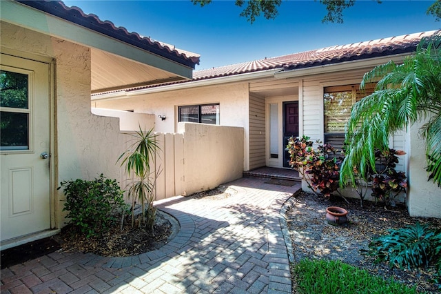 4812 Kestral Park Cir Unit 20, Sarasota, FL 34231 - property entrance with stucco siding and a tile roof
