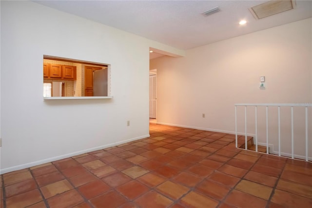 4812 Kestral Park Cir Unit 20, Sarasota, FL 34231 - unfurnished room with tile patterned flooring, baseboards, visible vents, and recessed lighting