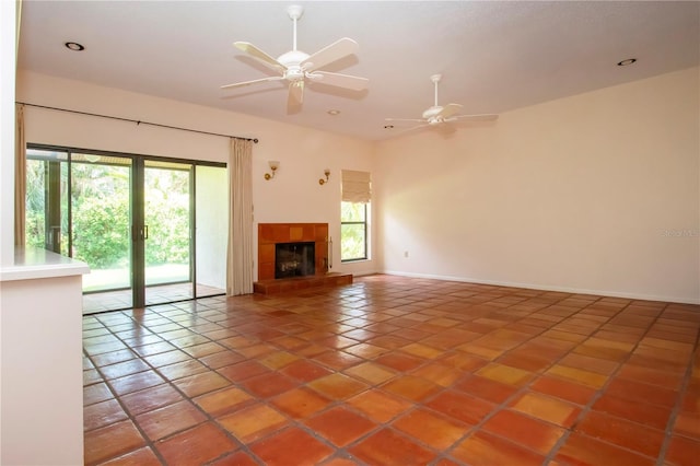 4812 Kestral Park Cir Unit 20, Sarasota, FL 34231 - unfurnished living room featuring a ceiling fan, recessed lighting, baseboards, light tile patterned flooring, and a fireplace