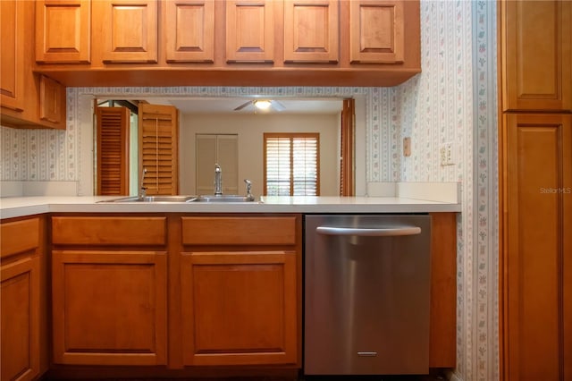 4812 Kestral Park Cir Unit 20, Sarasota, FL 34231 - kitchen featuring a ceiling fan, wallpapered walls, stainless steel dishwasher, a sink, and light countertops