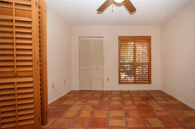 4812 Kestral Park Cir Unit 20, Sarasota, FL 34231 - unfurnished bedroom featuring baseboards and ceiling fan