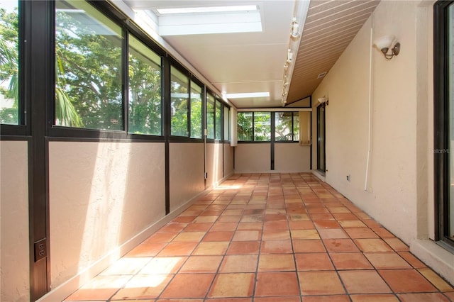 4812 Kestral Park Cir Unit 20, Sarasota, FL 34231 - unfurnished sunroom featuring rail lighting