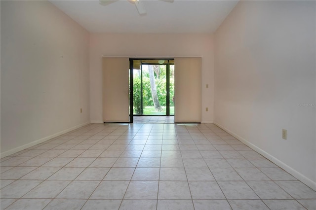 4812 Kestral Park Cir Unit 20, Sarasota, FL 34231 - empty room with ceiling fan, baseboards, and light tile patterned floors