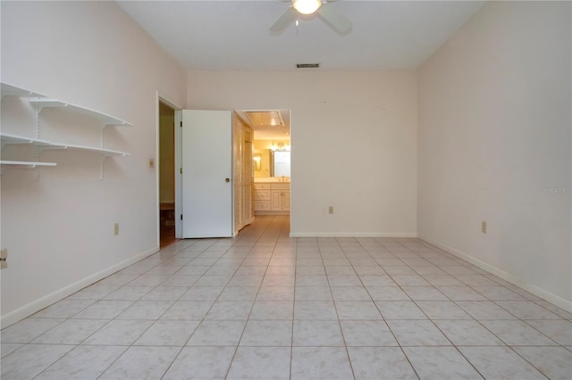 4812 Kestral Park Cir Unit 20, Sarasota, FL 34231 - empty room with attic access, light tile patterned floors, baseboards, ceiling fan, and visible vents