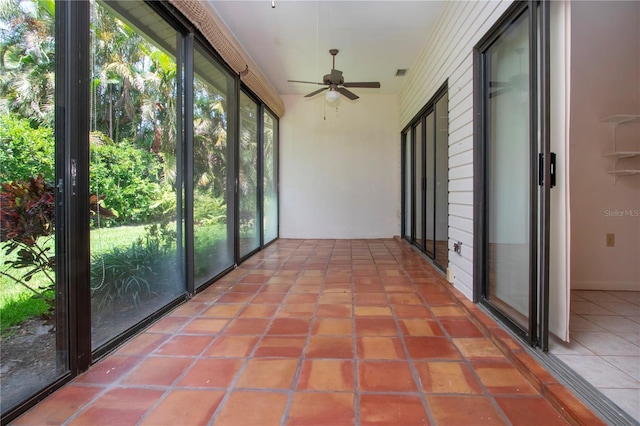 4812 Kestral Park Cir Unit 20, Sarasota, FL 34231 - unfurnished sunroom featuring visible vents and a ceiling fan