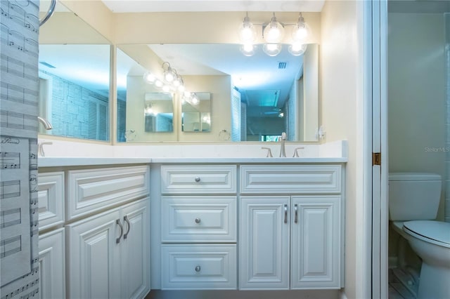 4812 Kestral Park Cir Unit 20, Sarasota, FL 34231 - full bath with double vanity, toilet, visible vents, and a sink