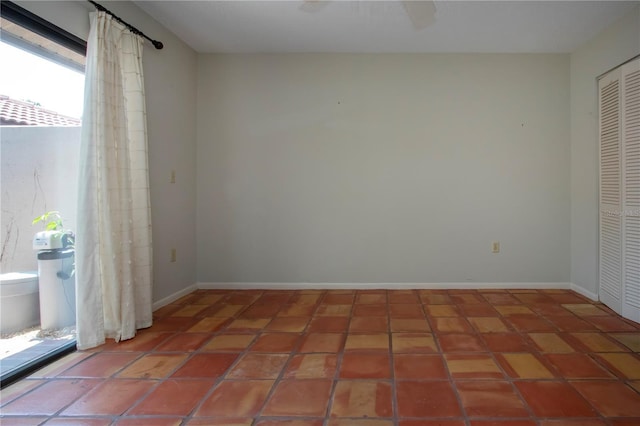 4812 Kestral Park Cir Unit 20, Sarasota, FL 34231 - unfurnished room with tile patterned flooring and baseboards