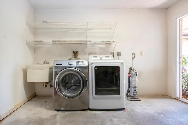 4812 Kestral Park Cir Unit 20, Sarasota, FL 34231 - clothes washing area featuring independent washer and dryer, a sink, and laundry area