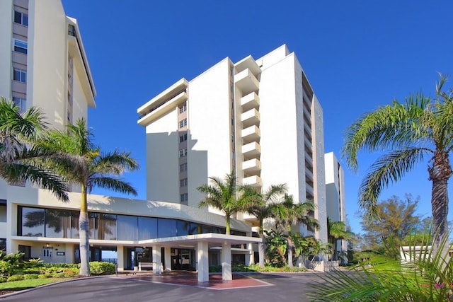 20 Whispering Sands Dr Unit 1201, Sarasota, FL 34242 - view of building exterior featuring uncovered parking