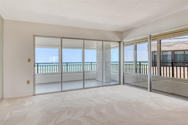 20 Whispering Sands Dr Unit 1201, Sarasota, FL 34242 - unfurnished sunroom with a water view