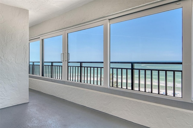 20 Whispering Sands Dr Unit 1201, Sarasota, FL 34242 - view of home's exterior with view of water and beach, stucco siding, and a balcony