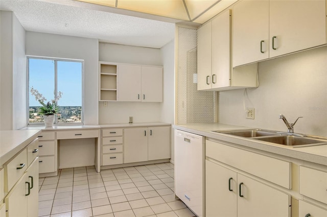 20 Whispering Sands Dr Unit 1201, Sarasota, FL 34242 - kitchen with a sink, white dishwasher, open shelves, light countertops, and light tile patterned flooring