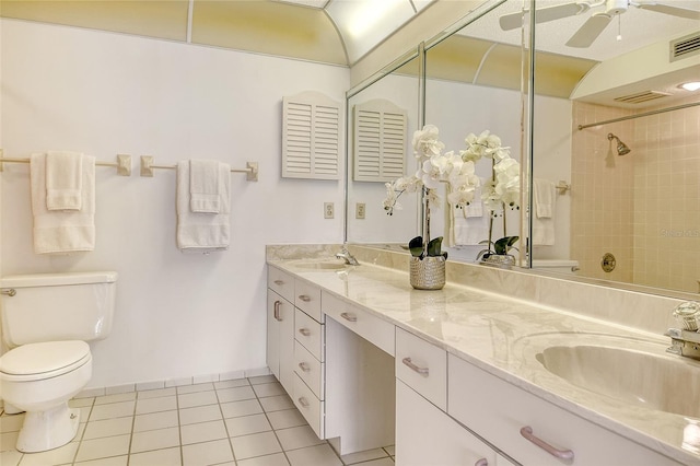 20 Whispering Sands Dr Unit 1201, Sarasota, FL 34242 - bathroom with toilet, double vanity, a shower, tile patterned floors, and ceiling fan