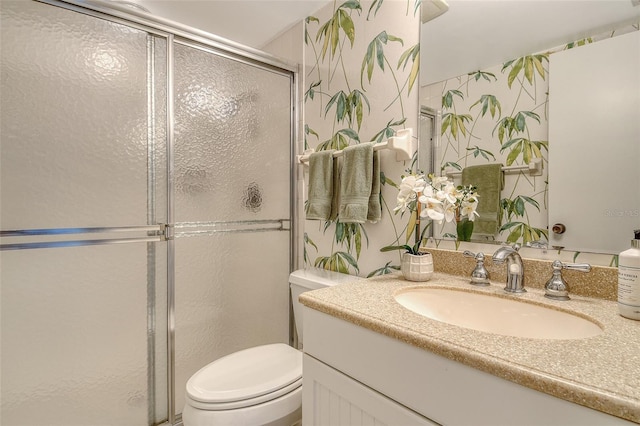 20 Whispering Sands Dr Unit 1201, Sarasota, FL 34242 - bathroom with vanity, a shower with door, and toilet