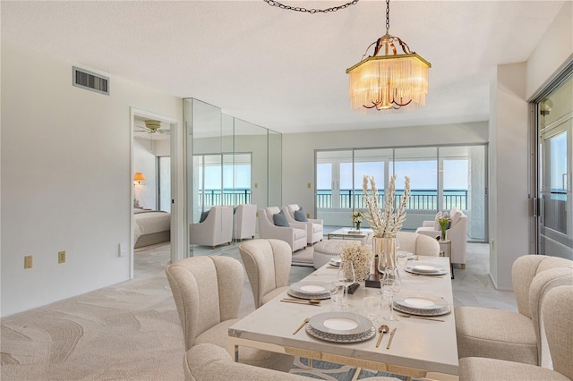 20 Whispering Sands Dr Unit 1201, Sarasota, FL 34242 - dining area with healthy amount of natural light and a chandelier