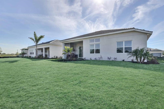 17927 Palmiste Dr, Bradenton, FL 34202 - view of front of home with a front yard and stucco siding