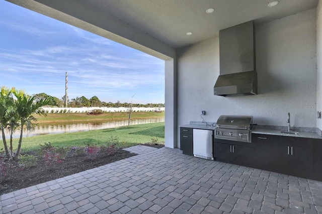 17927 Palmiste Dr, Bradenton, FL 34202 - view of patio / terrace with area for grilling, exterior kitchen, a water view, and a sink