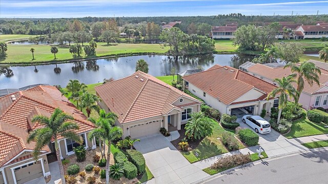 bird's eye view with a water view and a residential view