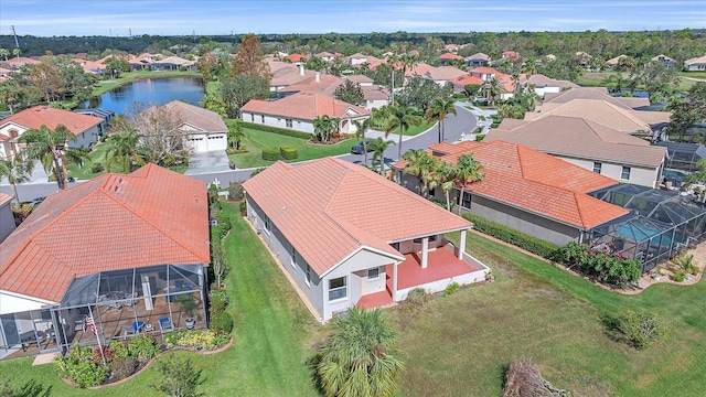 bird's eye view with a water view and a residential view