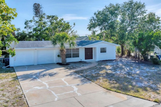 4907 4th Avenue Cir NW, Bradenton, FL 34209 - ranch-style house featuring concrete driveway, stucco siding, and an attached garage