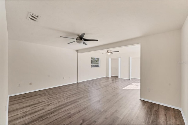 4907 4th Avenue Cir NW, Bradenton, FL 34209 - spare room featuring baseboards, visible vents, dark wood-style flooring, and a ceiling fan
