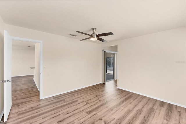 4907 4th Avenue Cir NW, Bradenton, FL 34209 - spare room featuring baseboards, a ceiling fan, visible vents, and wood finished floors